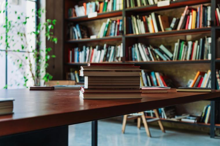 table and books on bookshelf