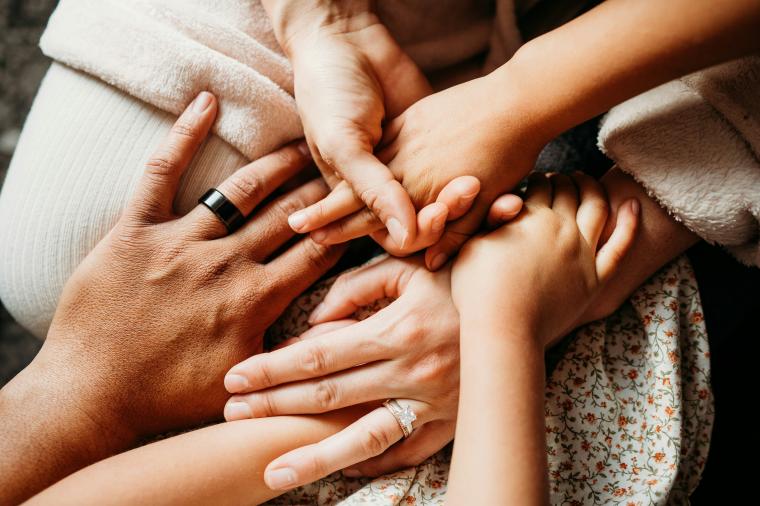 hands of family members