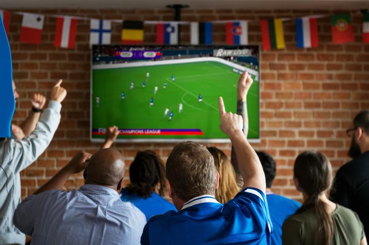people watching soccer at bar