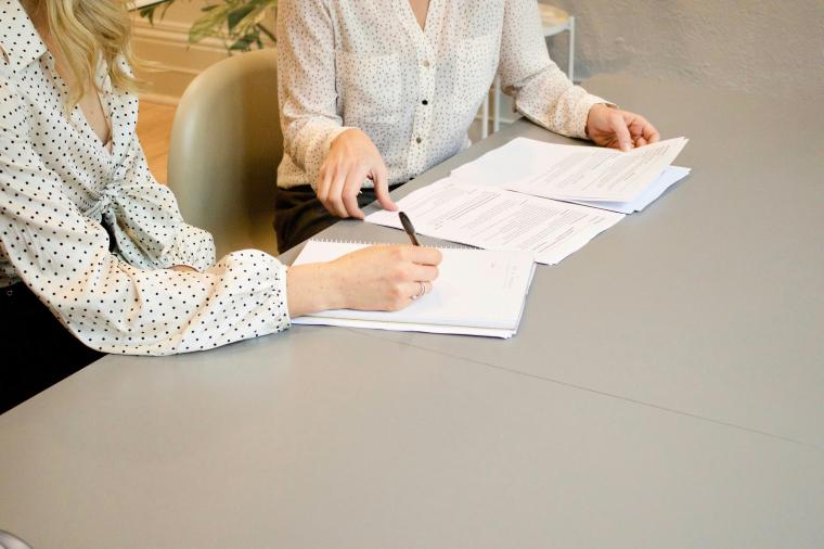 people looking over paperwork