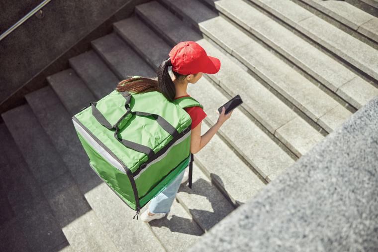 delivery worker on staircase