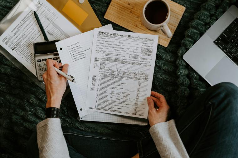 person reviewing tax form