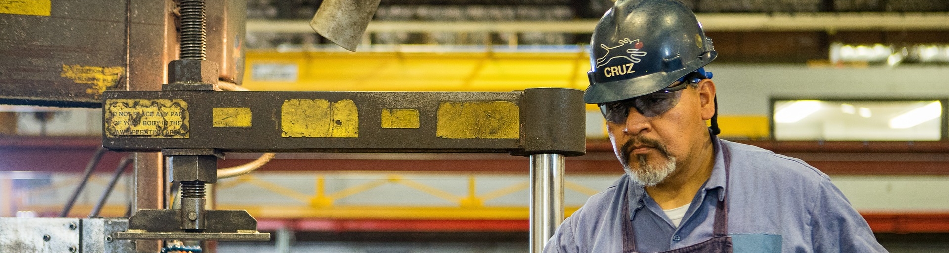 worker in hard hat at a steel plant